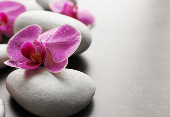 Obraz na płótnie Canvas Spa stones and orchids, closeup