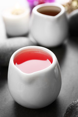 Beautiful spa set with massage oil, close up