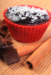 Muffins with desiccated coconut, chocolate, anise and cinnamon
