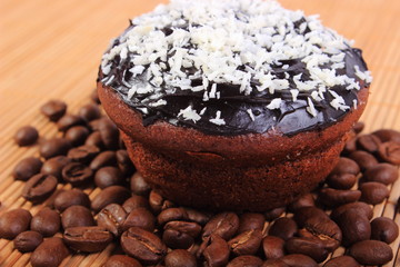 Chocolate muffins with desiccated coconut and coffee grains