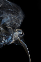 Abstract blue smoke from aromatic sticks.