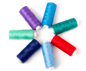 colored thread for sewing isolated on white background