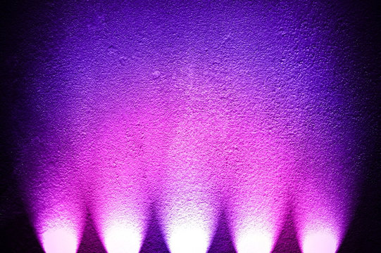 concrete wall with colorful spotlight
