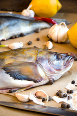 grinling fish with vegetables onions garlic lemon