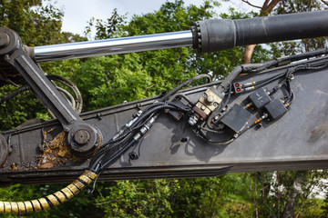 Detail of hydraulic bulldozer excavator piston arm in the mechanical oil and fuel oil on open air