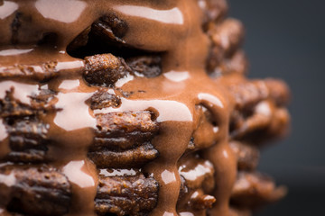 Stack of pancakes with chocolate syrup. Shallow depth of field.