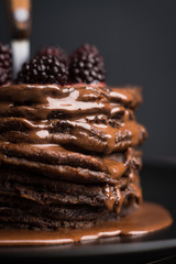 Stack of pancakes with fresh blackberries. Shallow depth of field.