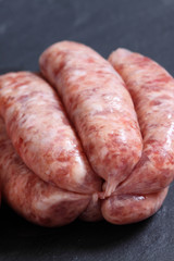 Sausages raw slate / Raw sausages on a slate background