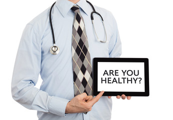 Doctor holding tablet - Are you healthy?