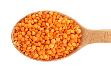 Wooden spoon with lentils isolated on white background.