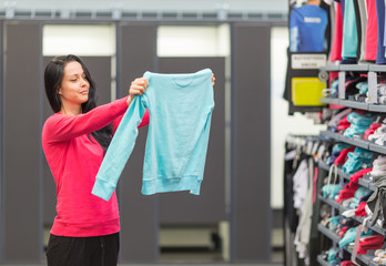 woman shopping in clothing store