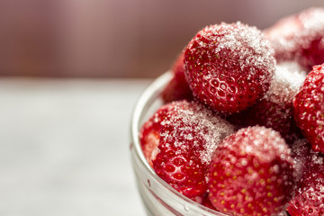 Sugared strawberries in a glass cup