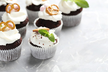 Chocolate cupcakes on a grey background