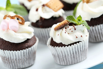 Chocolate cupcakes on a blue wooden table