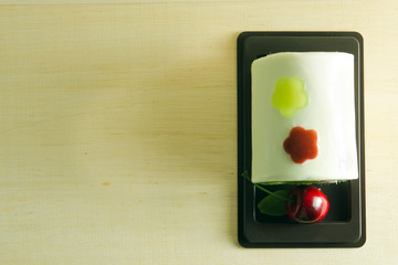 Fancy soap in cake form with cherry on the top with blank space