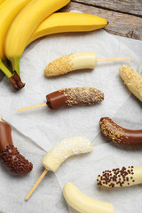 Banana covered in chocolate on a pergament