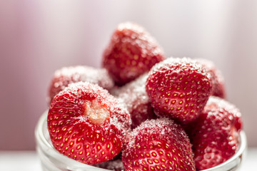 Sugared strawberries in a glass cup