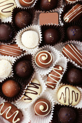 Chocolates on grey wooden background