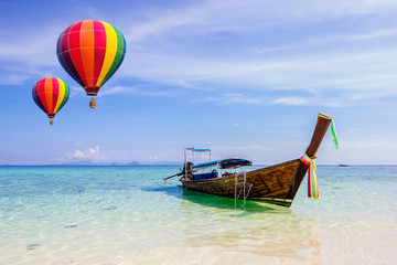 Colorful hot-air balloons flying over the sea at Krabi, Thailand.