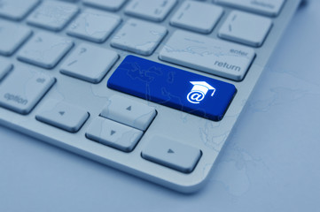 E-learning icon on modern computer keyboard button with world ma