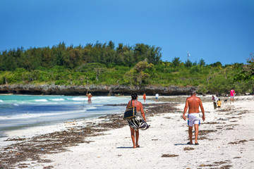 ZANZIBAR, TANZANIA - AUGUST 10, 2015: Tourists enjoying a beautiful sunny day in Zanzibar, Tanzania, Africa.