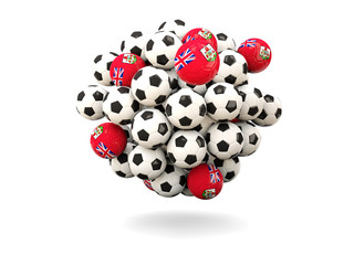 Pile of footballs with flag of bermuda