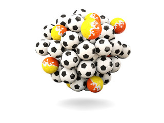 Pile of footballs with flag of bhutan
