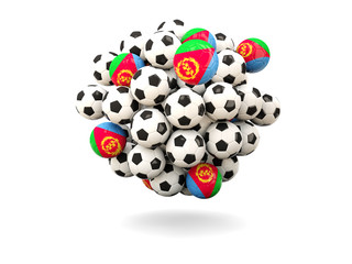 Pile of footballs with flag of eritrea