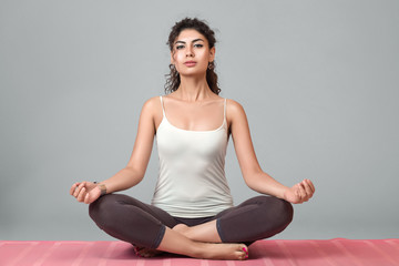 Fototapeta premium Woman meditating in lotus position