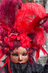 Red masked woman at Venice carnival