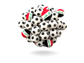 Pile of footballs with flag of iraq