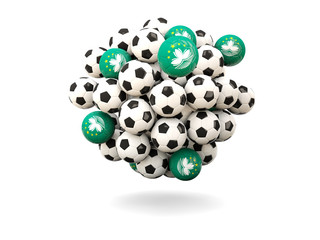 Pile of footballs with flag of macao