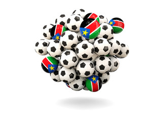 Pile of footballs with flag of south sudan