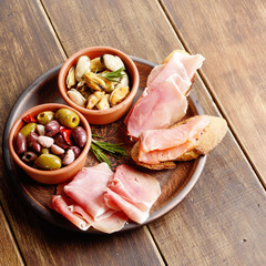 Tapas of salmon, mussels, jamon and olives