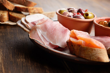 Tapas of salmon, mussels, jamon and olives