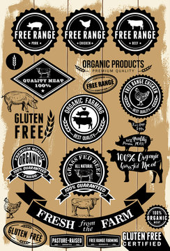 A collection of free range and organic labels on wooden background 