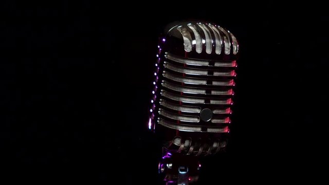 Classic Vocal Microphone rotating and reflects stage lights 