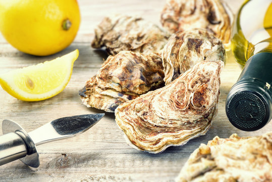 Fresh oysters with white wine bottle