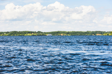 Cruise vessel sailing at summer day on Volga river, Russia.