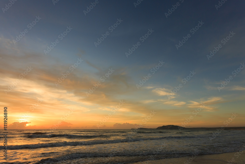 Wall mural sunset dramatic sky with colorful cloud on sea