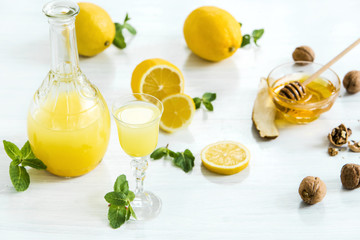 Italian traditional liqueur limoncello with lemon