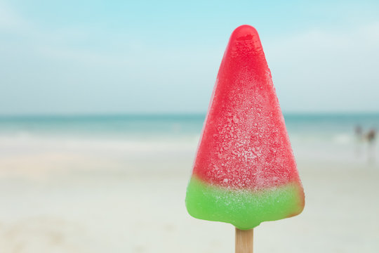 Watermelon ice-cream summer time on sea beach.
In summer season, it's very good to have some colorful watermelon ice cream to refresh and cool down hot weather. Good time on vacation at sea beach.