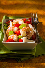 Shrimp salad over a green napkin