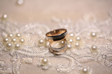 Wedding bands on embroidered cloth