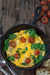 Delicious frittata with spinach and tomatoes