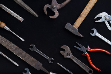 Accessory, assorted tools set on wooden light background. Construction assortment instruments for repairman, carpenter, builder. Copy space for text. Top view.
