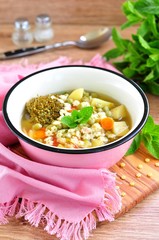 Soup of the rabbit meat with broccoli, green peas, carrots and pasta stars