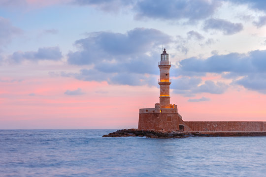 Lighthouse in old harbour of Chania at dawn, Crete, Greece