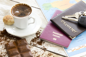 Travel planning over world map. Turkish coffee, passport and key