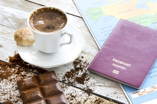 Travel planning over world map. Turkish coffee, passport and key